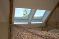 two skylight windows in a room with at Gite Oliveira&#39;s in Ury