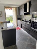 a kitchen with stainless steel appliances and a counter top at NICE BAIE DES ANGES in Nice