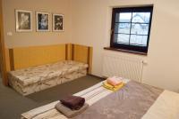 Postel nebo postele na pokoji v ubytování Apartmány Cestář Boží Dar
