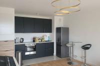 Kuchyňa alebo kuchynka v ubytovaní Appartement chic 5 min Disneyland/Vallée Village