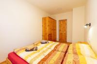 Postel nebo postele na pokoji v ubytování Apartmány Petra