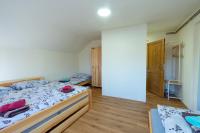 Postel nebo postele na pokoji v ubytování Apartmány Petra