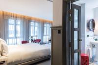 Ann Siang House, The Unlimited Collection managed by The Ascott Limitedにあるベッド