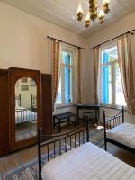 Posteľ alebo postele v izbe v ubytovaní Yioklima - Renovated Neoclassical House with two bedrooms
