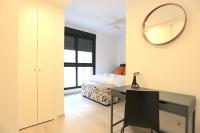 A bed or beds in a room at SOUL Malaga City Apartment