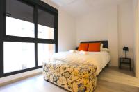 A bed or beds in a room at SOUL Malaga City Apartment