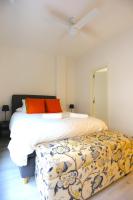 A bed or beds in a room at SOUL Malaga City Apartment