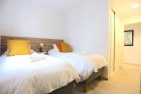 A bed or beds in a room at SOUL Malaga City Apartment