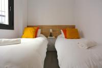 A bed or beds in a room at SOUL Malaga City Apartment