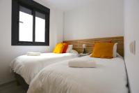 A bed or beds in a room at SOUL Malaga City Apartment