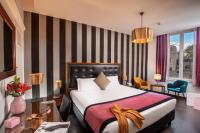 Posteľ alebo postele v izbe v ubytovaní Navona Colors Hotel