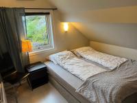 Postel nebo postele na pokoji v ubytování Holiday home Brandasund II