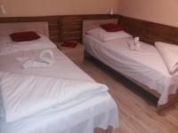 Posteľ alebo postele v izbe v ubytovaní Abszolút Hotel és Panzió