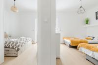 Posteľ alebo postele v izbe v ubytovaní Sun&Sport Apartament MAJA z ogródkiem