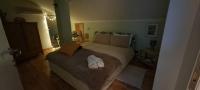 A bed or beds in a room at La Mia Mansardina