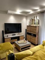 En TV eller et underholdningssystem p&aring; Appartement calme proche Bastia