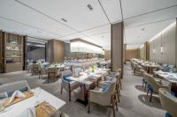 Un restaurante u otro lugar para comer en Wanda Realm Kunming