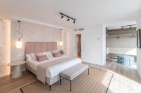 Łóżko lub łóżka w pokoju w obiekcie Exclusive Penthouse & terrace by ELE Apartments