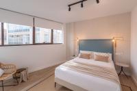 Łóżko lub łóżka w pokoju w obiekcie Exclusive Penthouse & terrace by ELE Apartments