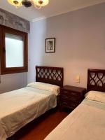 Posteľ alebo postele v izbe v ubytovaní Apartamento Edificio Cunchas