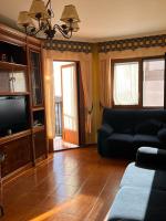 Televízia a/alebo spoločenská miestnosť v ubytovaní Apartamento Edificio Cunchas