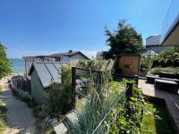 a garden with a fence and some plants at Grafit in Mechelinki