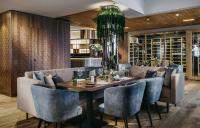 a dining room with a table and chairs at Grand Tirolia Kitzbühel - Member of Hommage Luxury Hotels Collection in Kitzbühel