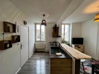 a kitchen with a sink and a counter top at Home Sweet Home in Roanne