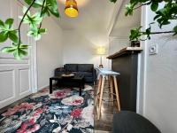 a living room with a couch and a table at Home Sweet Home in Roanne