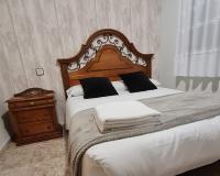 Postel nebo postele na pokoji v ubytování Apartamentos Los Robles