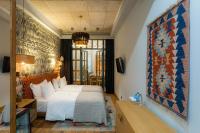a bedroom with a large white bed in a room at Khedi Hotel Tbilisi in Tbilisi City