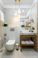 a bathroom with a toilet and a sink at Khedi Hotel Tbilisi in Tbilisi City