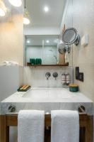 a bathroom with a large tub with two towels at Khedi Hotel Tbilisi in Tbilisi City