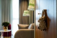a stuffed teddy bear hanging on the door of a hotel room at Khedi Hotel Tbilisi in Tbilisi City