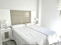Posteľ alebo postele v izbe v ubytovaní MI CAPRICHO 172 Beachfront Apartment