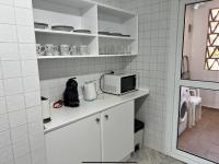 Kuchyňa alebo kuchynka v ubytovaní MI CAPRICHO 172 Beachfront Apartment