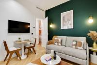 Televízia a/alebo spoločenská miestnosť v ubytovaní Chic Apartment - 1BR-4P - Facing the Louvre