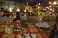 a table in a restaurant with a table cloth on it at El Gezira Garden Hotel Luxor in Luxor