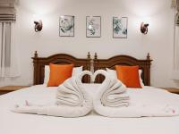 Postel nebo postele na pokoji v ubytování Villa Thai Orchid (adult only)