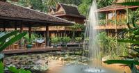 una cascada frente a un edificio con un estanque en Angkor Village Hotel - Small Luxury Hotels of the World, en Siem Reap