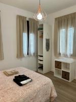 Posteľ alebo postele v izbe v ubytovaní Coqueto apartamento céntrico con piscina