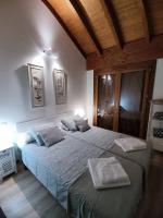 Postel nebo postele na pokoji v ubytování Casa Balcón de Los Pirineos - Gavín Biescas