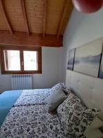 Postel nebo postele na pokoji v ubytování Casa Balcón de Los Pirineos - Gavín Biescas