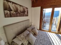 Postel nebo postele na pokoji v ubytování Casa Balcón de Los Pirineos - Gavín Biescas