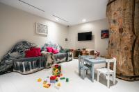 a living room with a couch and a table at Hôtel La Sivolière in Courchevel