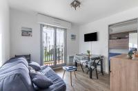 Telewizja i/lub zestaw kina domowego w obiekcie Océania -proche Mer et Thalasso