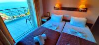 Posteľ alebo postele v izbe v ubytovaní Mitho Hotel Spa