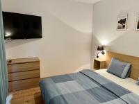 Posteľ alebo postele v izbe v ubytovaní Zielone Apartamenty Katowice Chorzów