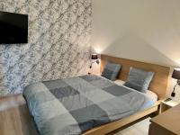 Posteľ alebo postele v izbe v ubytovaní Zielone Apartamenty Katowice Chorzów
