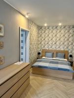 Posteľ alebo postele v izbe v ubytovaní Zielone Apartamenty Katowice Chorzów